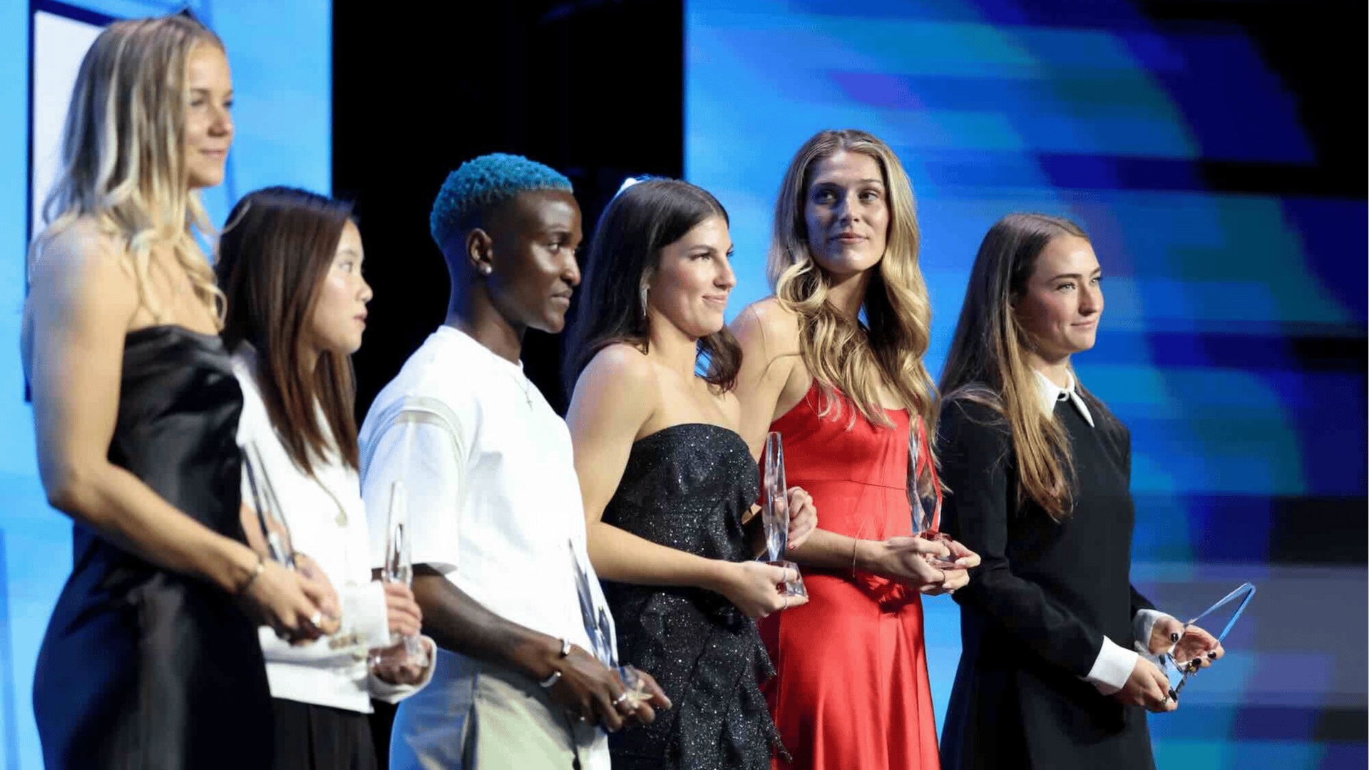 Claire Hutton #14 of Kansas City Current, Manaka Matsukubo #34 of NC Courage, Temwa Chawinga #6 of Kansas City Current, Izzy Rodriguez #18 of Kansas City Current, Kayla Sharples #27 of Kansas City Current and Tara McKeown #9 of Washington Spirit receive the Best XI award, presented by Amazon Prime during the 2025 NWSL Awards at Montgomery Theater on November 19, 2025 in San Jose, California.