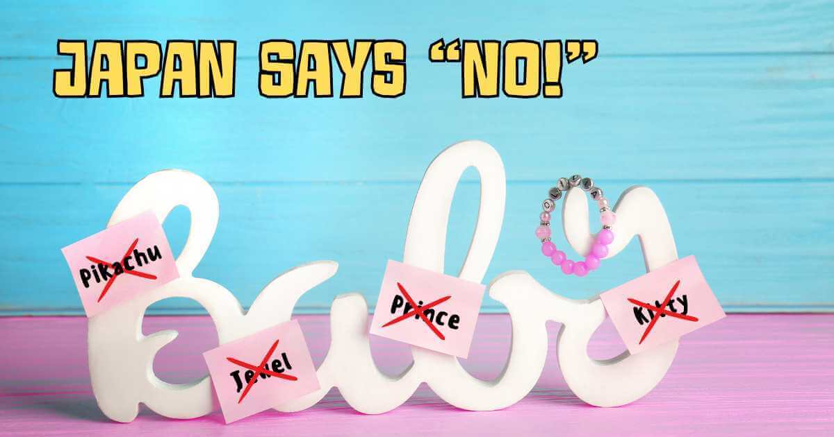 The phrase "Japan Says 'No!'" in yellow text above a white "Baby" cutout word. Pink sticky notes with "Pikachu," "Jewel," "Prince," and "Kitty" written on them are crossed out on the letters. A pink and silver beaded bracelet rests on the "b".