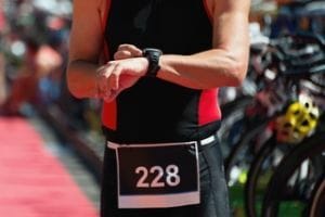 triatlete programming his triathlon watch