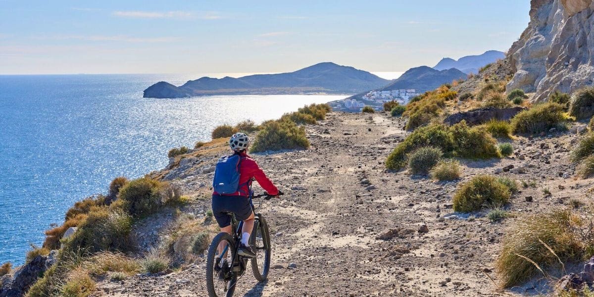 a biker biking on a trail