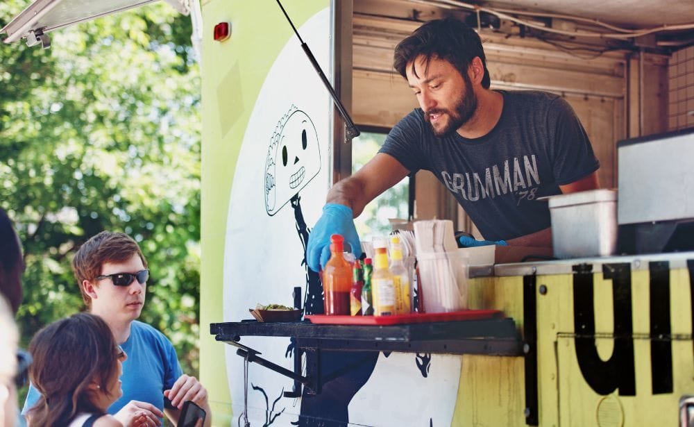 serving tacos out of a taco truck