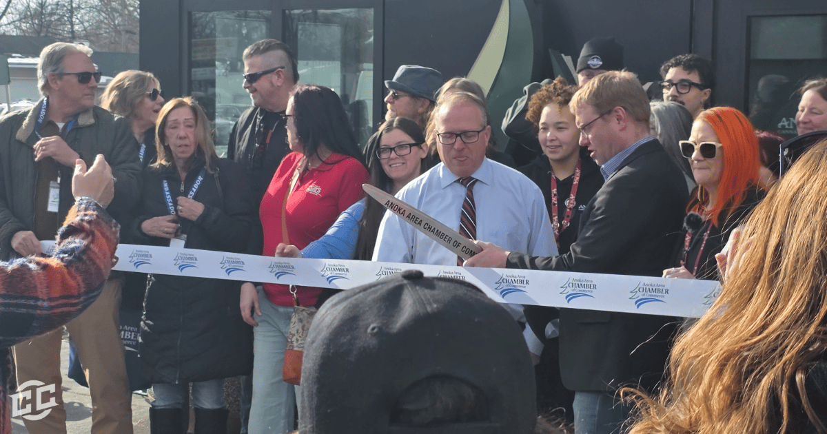 Close view of officials and guests as the ribbon is cut.