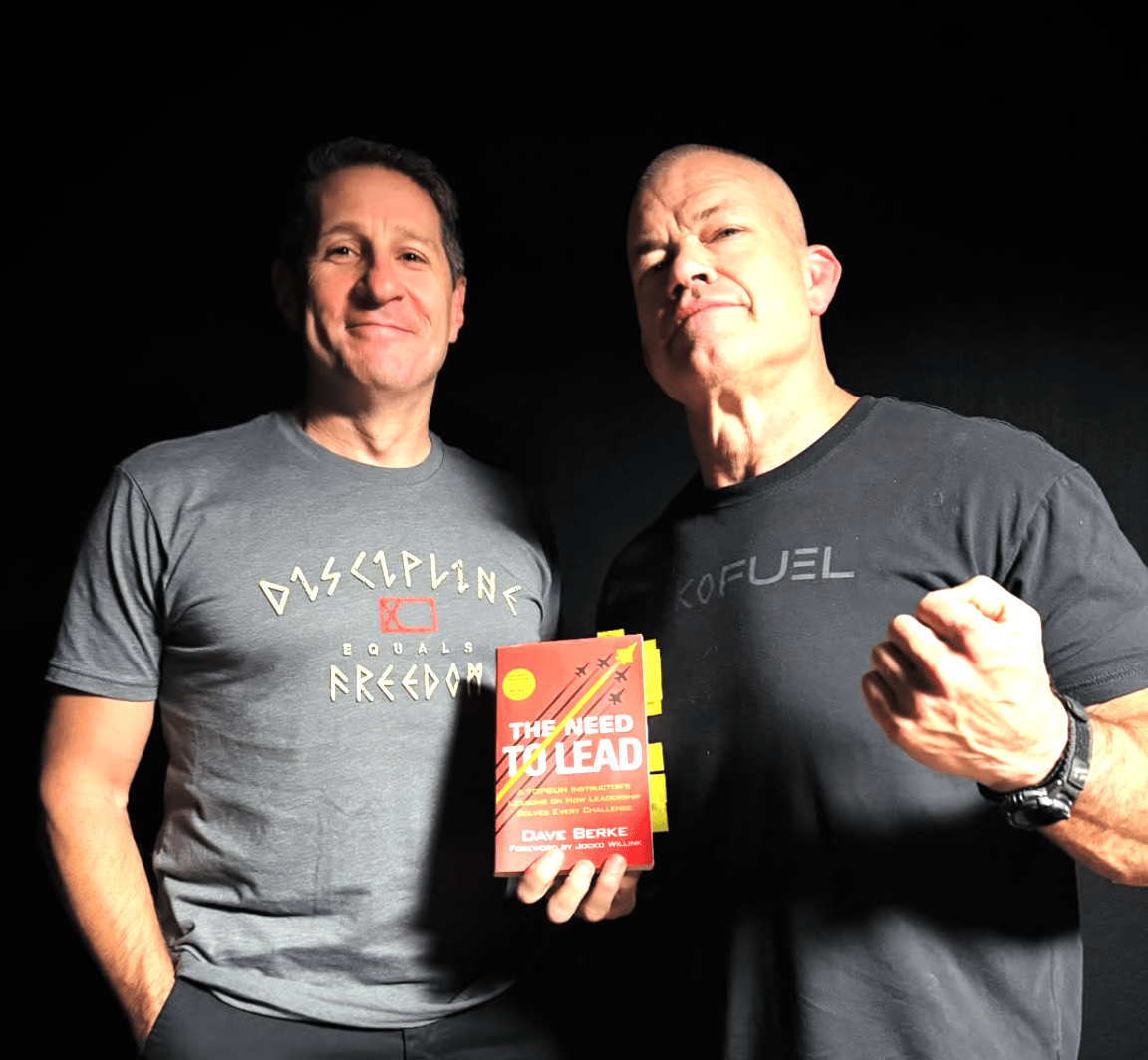 Marine pilot Dave Berke author of The Need to Lead 2025 standing with Former navy seal Jocko Willlink with his new book