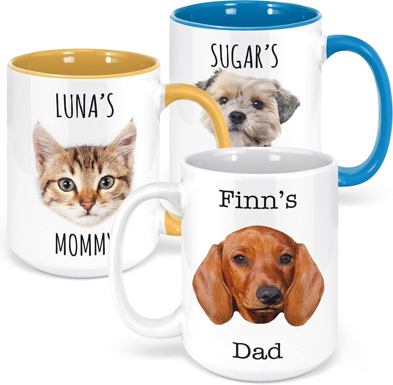Personalized Pet Mom Mug A white ceramic mug with a custom illustration of a dog’s face and the phrase “Pawsitively the Best Dog Mom” sitting on a kitchen table beside a steaming cup of coffee.