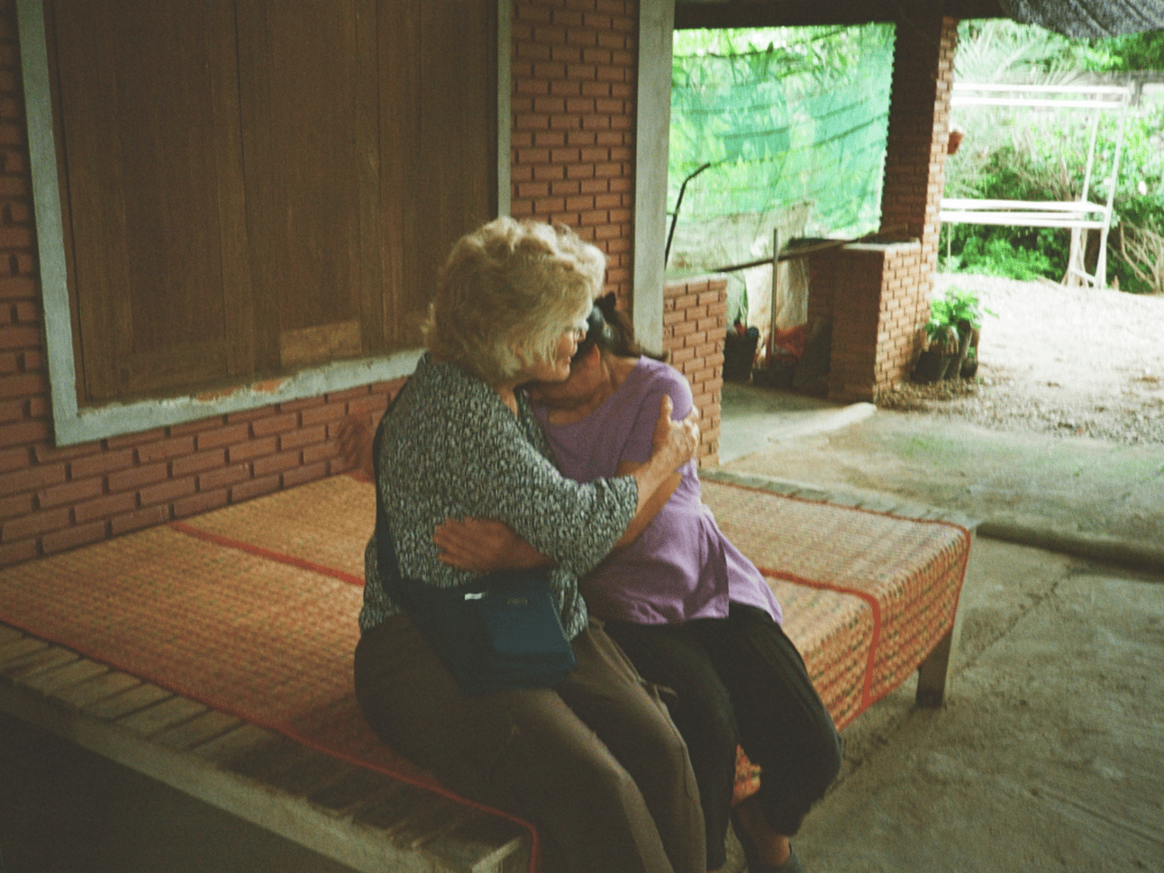 Mom hugs our weeping friend.
