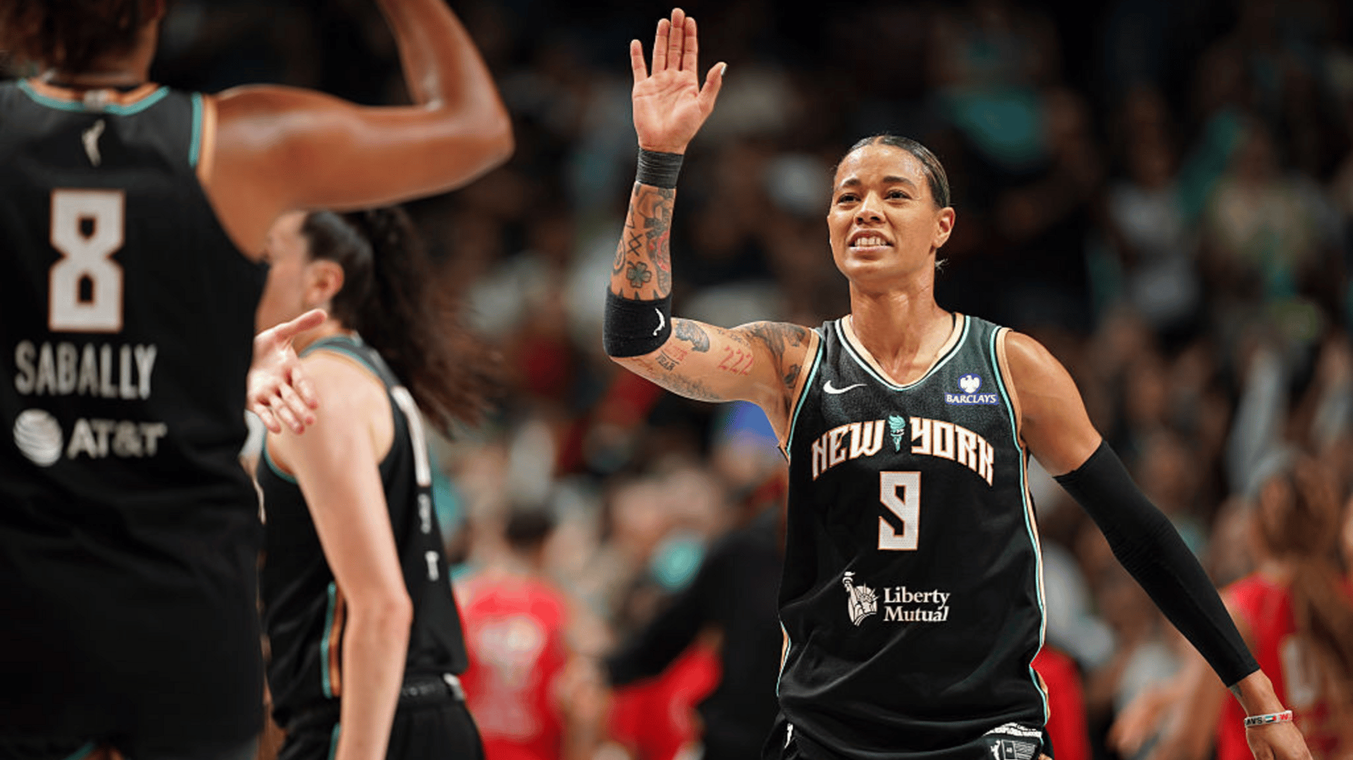 Natasha Cloud #9 of the New York Liberty high fives Nyara Sabally #8 during the game against the Atlanta Dream