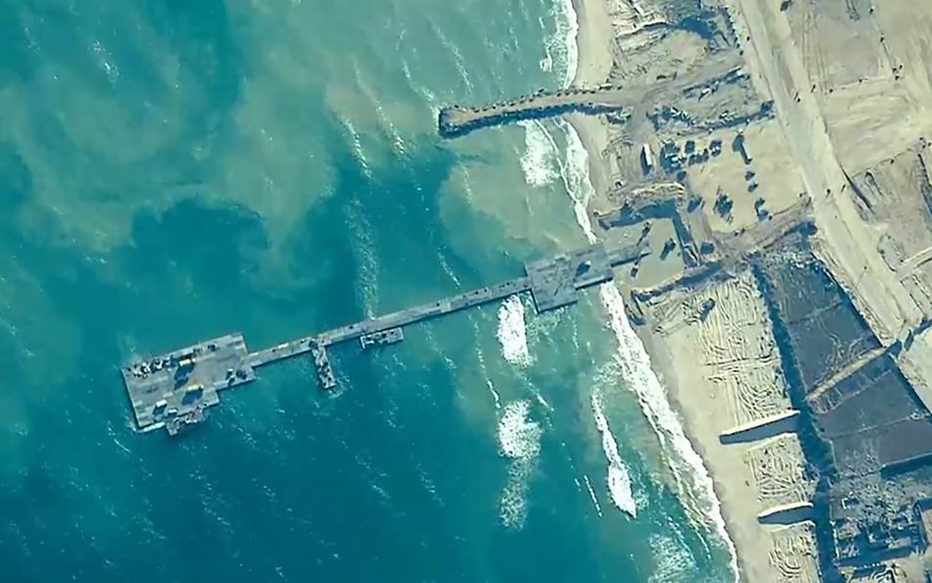 The Trident Pier, shown on the Gaza coast as of May 16, remained functional for 20 days, facilitating the delivery of 8,800 tonnes (19.4 million pounds) of humanitarian aid. Despite all the fanfare, AP News reports the outcome fell short of initial expectations and aid distribution was inconsistent. (Credit: U.S. Central Command via AP)