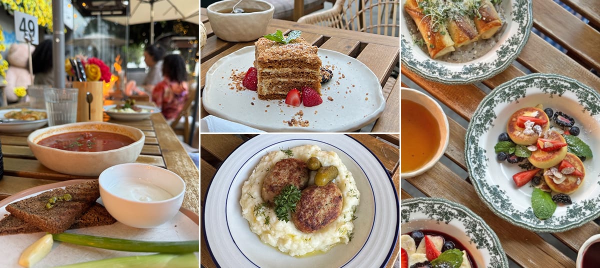 Selection of homemade dishes at Mom Please café in Los Angeles including syrnyky with sour cream, borscht, medovik cake with berries, and fresh fruit crepes served in a cozy outdoor setting