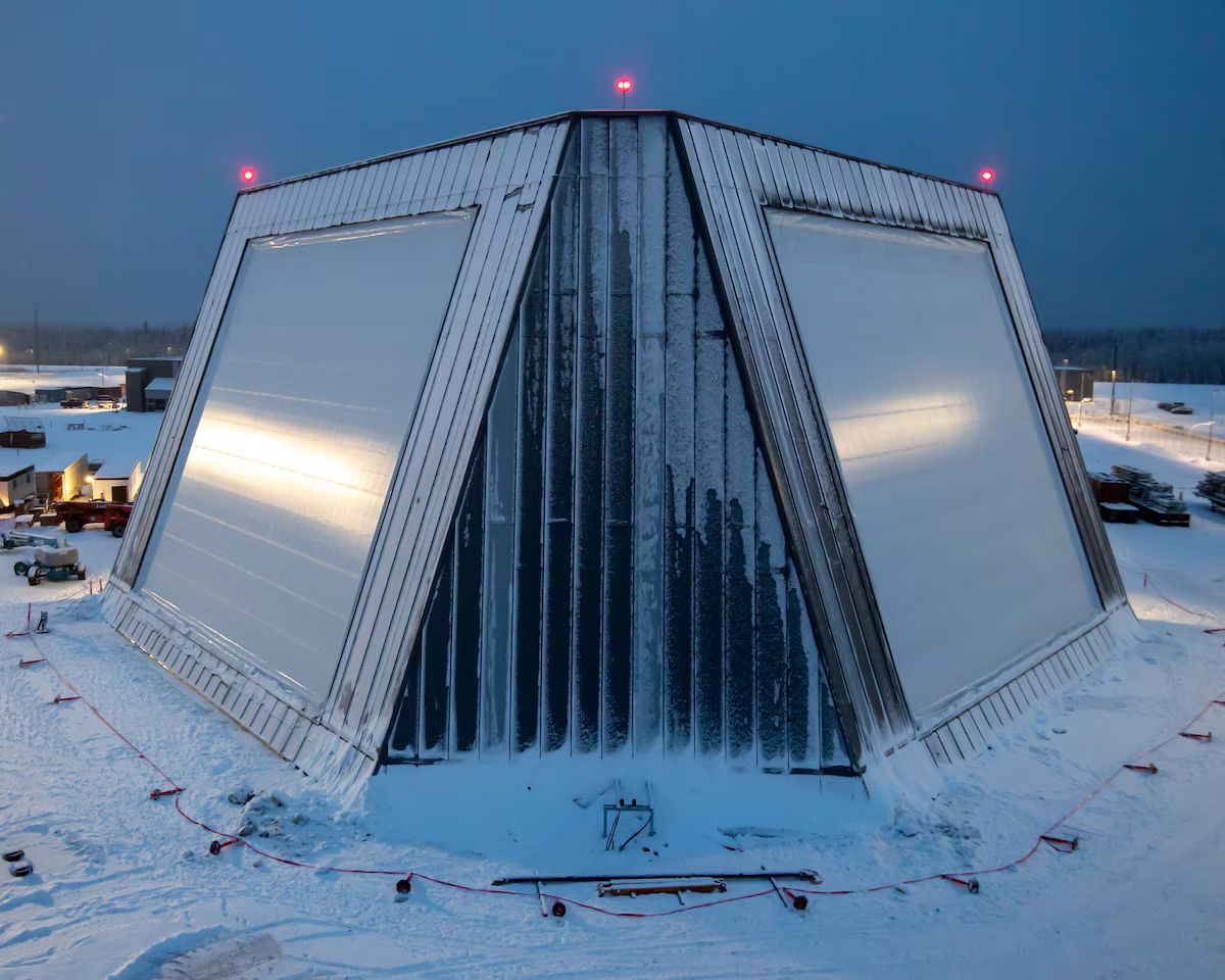 The U.S. Space Force, on December 4 formally took operational control of the Long Range Discrimination Radar (LRDR) at Clear Space Force Station in Alaska, marking a major step in expanding the service’s missile‑warning, tracking and targeting (MWT&T) as well as Space Domain Awareness (SDA) capabilities. The solid‑state system, accepted by the Combat Forces Command after the Missile Defense Agency completed LRDR's operational trial period, is designed to improve interceptor precision, shorten response times, and strengthen U.S. homeland defense against long‑range ballistic missile threats. The SDA functionality is slated for operational acceptance following a trial period with Command and Control, Battle and Management Communications and the&nbsp;National Space Defense Center. The newly released image shows the radar complex under heavy winter snow, highlighting the remote conditions in which the system will operate. The radar is built for precision discrimination, enabling it to distinguish lethal from non‑lethal ballistic‑missile objects in a crowded operating environment. It increases mission effectiveness by simultaneously searching, tracking, and discriminating multiple long‑range threats, supplying precise tracking and hit‑assessment data to the Ground‑Based Midcourse Defense Fire Control System. Its modular architecture allows future upgrades without major redesigns, and continuous threat monitoring maintains operational readiness even during maintenance, reducing system downtime.