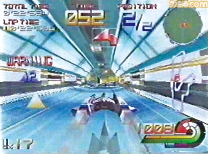 A gameplay screenshot from Vic Viper: Battle Racing, featuring the game's very busy HUD and the Vic Viper driving through a brightly lit tunnel.