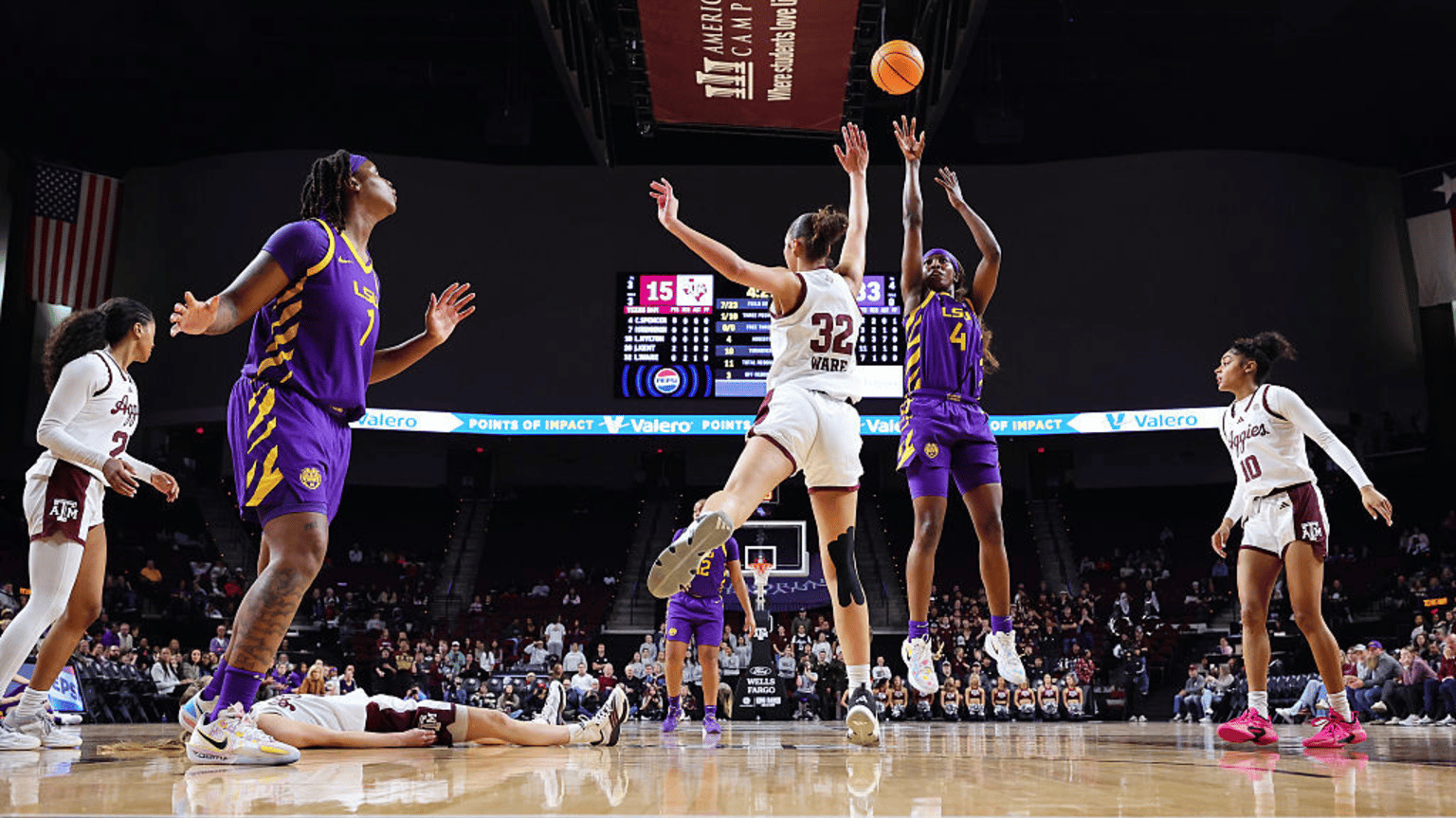 Flau'jae Johnson #4 of the LSU Tigers shoots the ball against Lauren Ware #32 of the Texas A&M Aggies during the first half at Reed Arena on January 22, 2026 in College Station, Texas