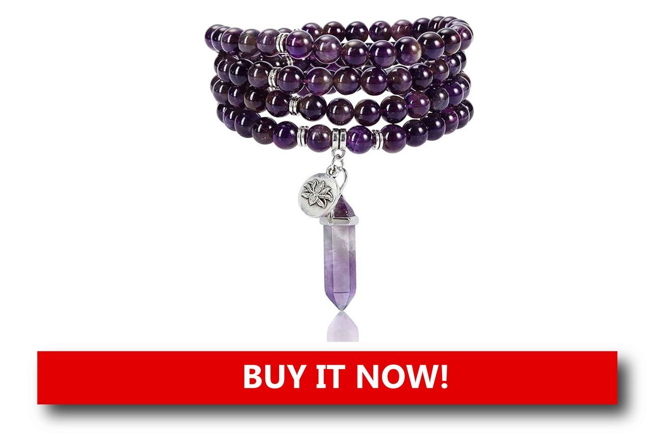 Crystal Prayer Beads Alt text: Elegant clear crystal prayer beads with a gold-accented cross pendant, arranged under warm Christmas lighting that enhances their sparkle.