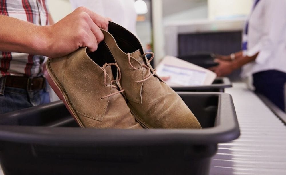 putting shoes in a bin