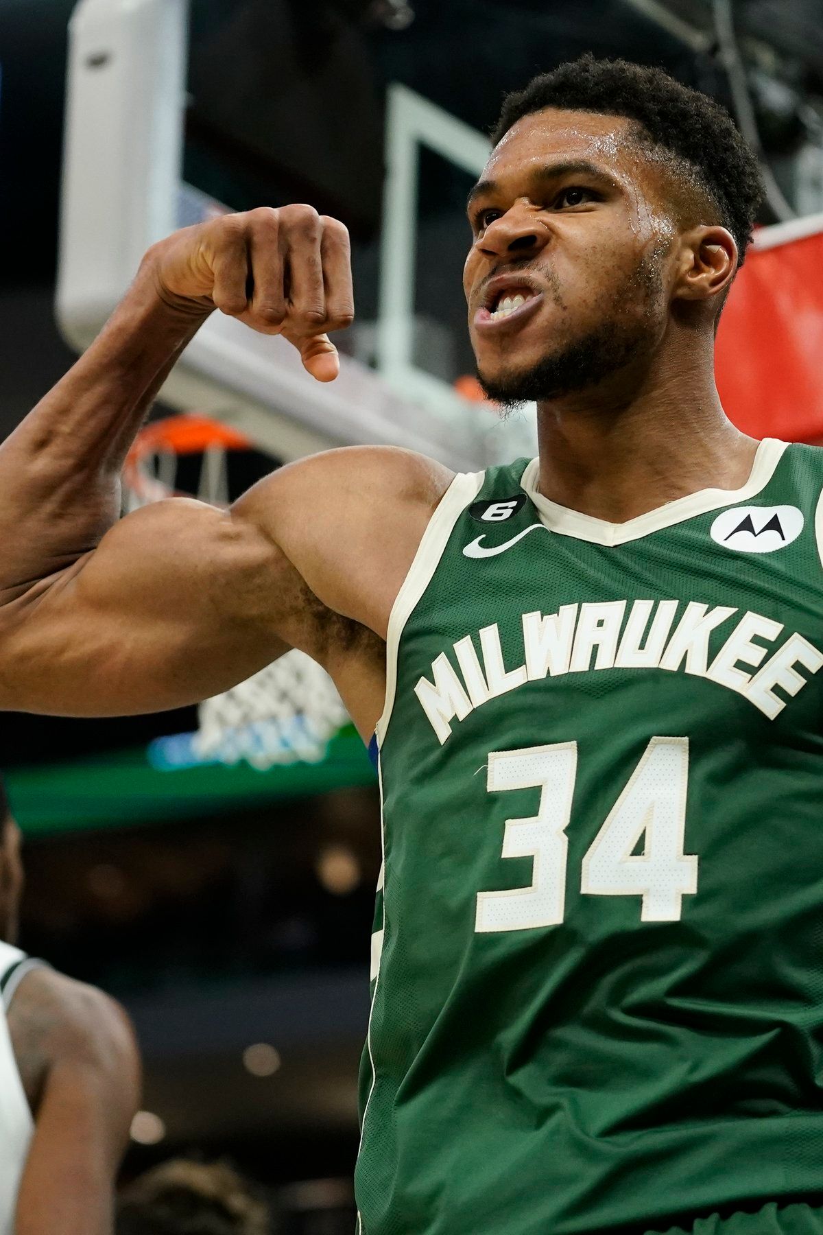 Picture of Giannis Antetokounmpo flexing his right bicep