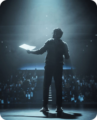 A man speaking at a lecture