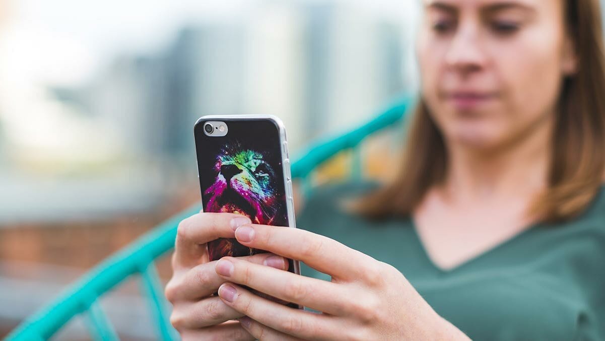 woman using smart phone with case