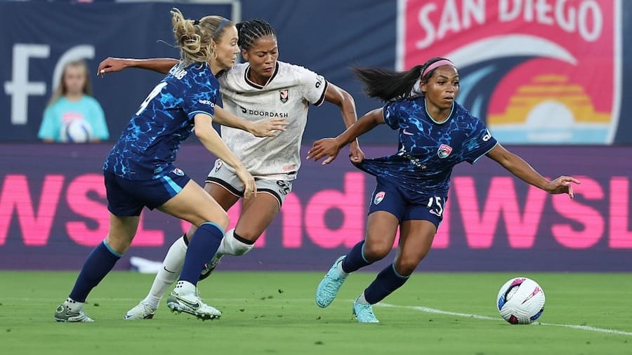 Perle Morroni #75 of San Diego Wave FC is challenged by Sveindis Jane Jonsdottir #32 of Angel City FC during the NWSL match between San Diego Wave and Angel City FC
