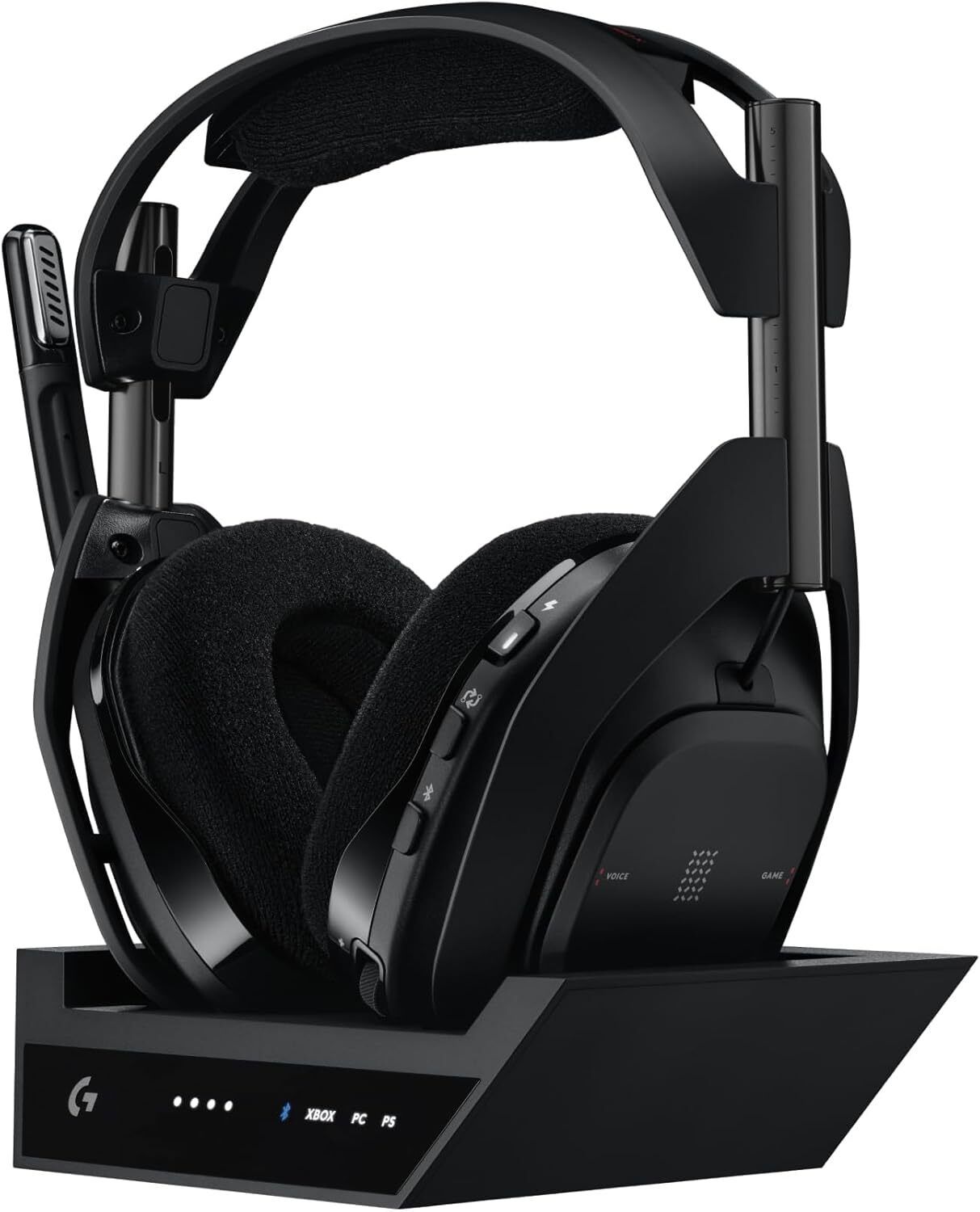 Astro A50 X – The Multi-Platform Star A high-end wireless headset with a sleek charging dock, placed in a gaming station supporting PC, Xbox, and PS5 for seamless play.