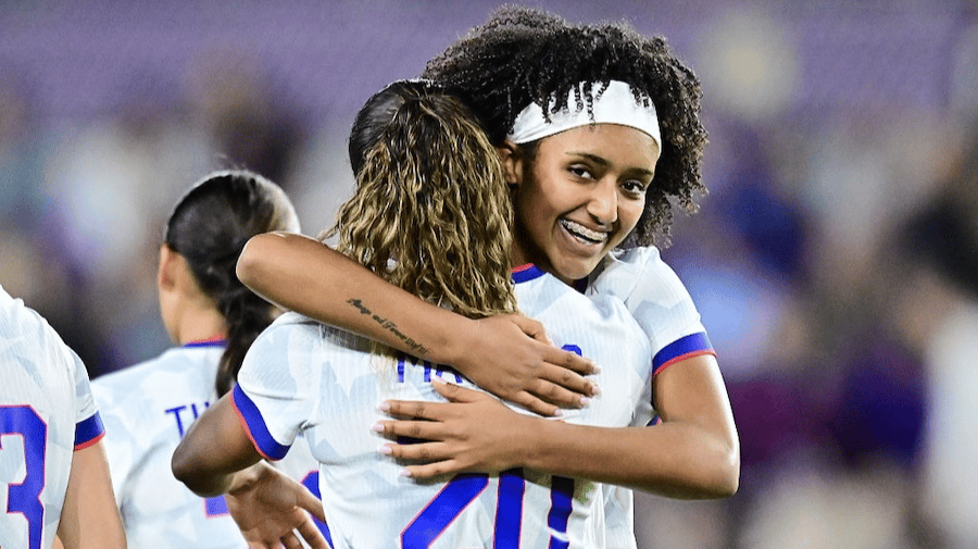  Lily Yohannes #7 hugs Catarina MacArio #20 of United States after a goal in the second half against Italy