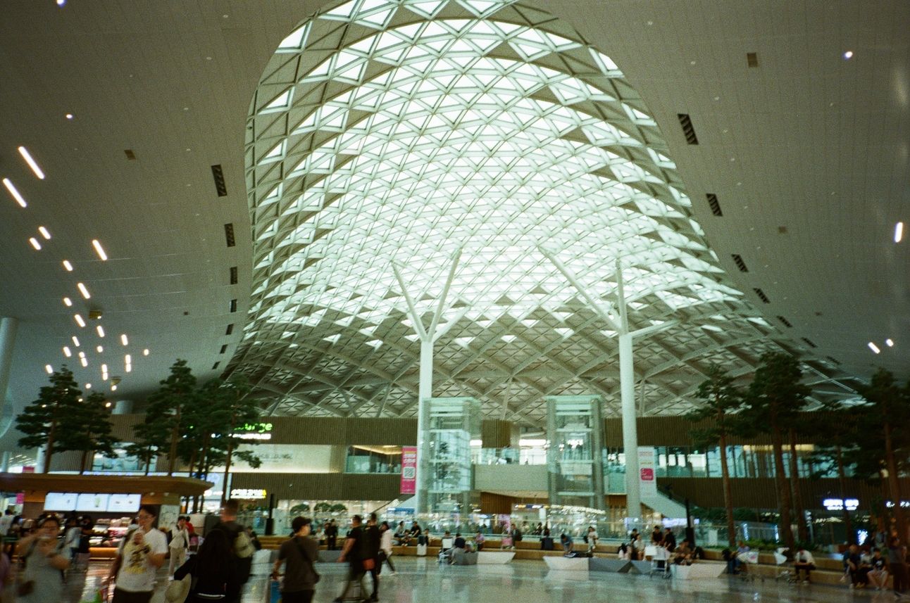 A terminal at Incheon International Airport with people walking around.