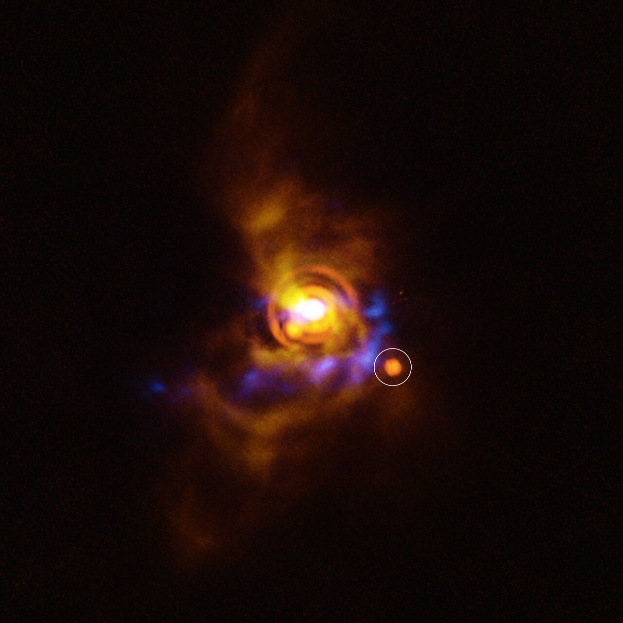 In parallel, another team observed V960 Mon, a nascent star exhibiting gravitational instability in its surrounding disc. They detected a compact, luminous object near one of its spiral arms, possibly a forming planet or brown dwarf. If confirmed, it would be the first direct evidence of a substellar companion forming via disc fragmentation. This image shows the possible companion orbiting V960 Mon. The star, located more than 5000 light-years away, is surrounded by a disc with intricate features. Previous analysis of the disc showed that it contains clumps of unstable material that could collapse to form a companion object. The new candidate found here could be either a planet or a brown dwarf –– an object bigger than a planet that didn’t gain enough mass to shine as a star. The candidate object was found with ESO’s Very Large Telescope (VLT), using its new Enhanced Resolution Imager and Spectrograph (ERIS). The new ERIS data are shown here in orange, overlaid on older images of the dusty disc as seen with the VLT’s SPHERE instrument (yellow) and the Atacama Large Millimeter/submillimeter Array (ALMA, in blue). 