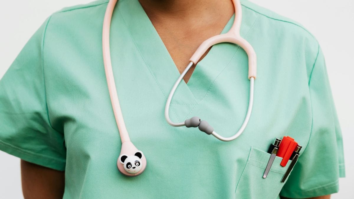 A close-up picture of a nurse uniform with a panda stethoscope