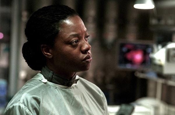 iola Davis as Dr. Gordon looking serious and concerned inside the futuristic setting of the space station in 'Solaris'.