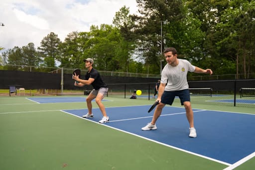 Brandon and Max drilling at pickleball