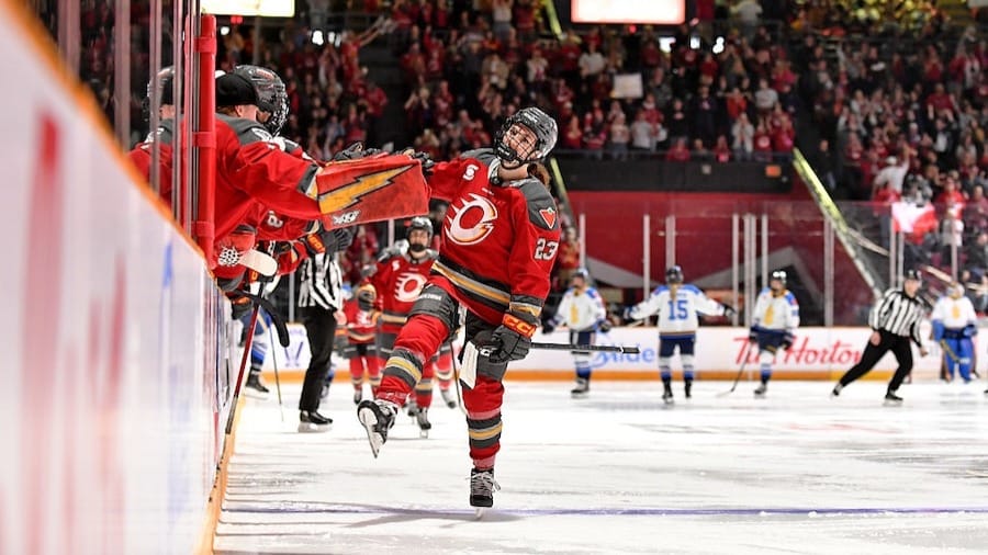 Sarah Wozniewicz #23 of the Ottawa Charge celebrates at the bench after scoring a goal against the Toronto Sceptres during the third period 