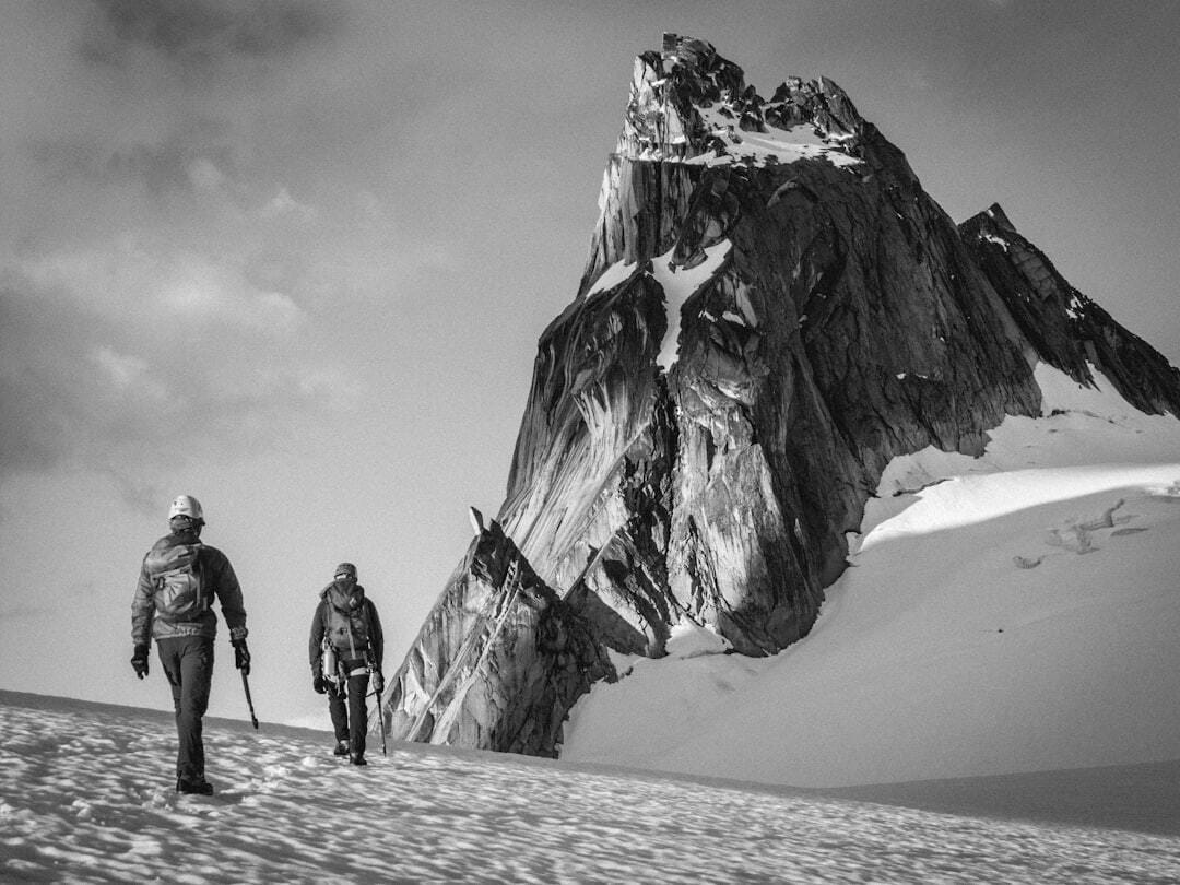 Up at about 3:30AM in order to make some hot drinks and food - we were underway at about 4:30, enjoying the sun hitting our backs as we lugged ourselves up to the Bugaboo Snowpatch col. Just as we stepped away from the col, there it was; the best 5.4 rock climb in the world, the West Ridge of Pigeon Spire! Now we were psyched! The perfectly triangular mountain loomed above us, begging to be climbed - today would be a day that we would not soon forget.