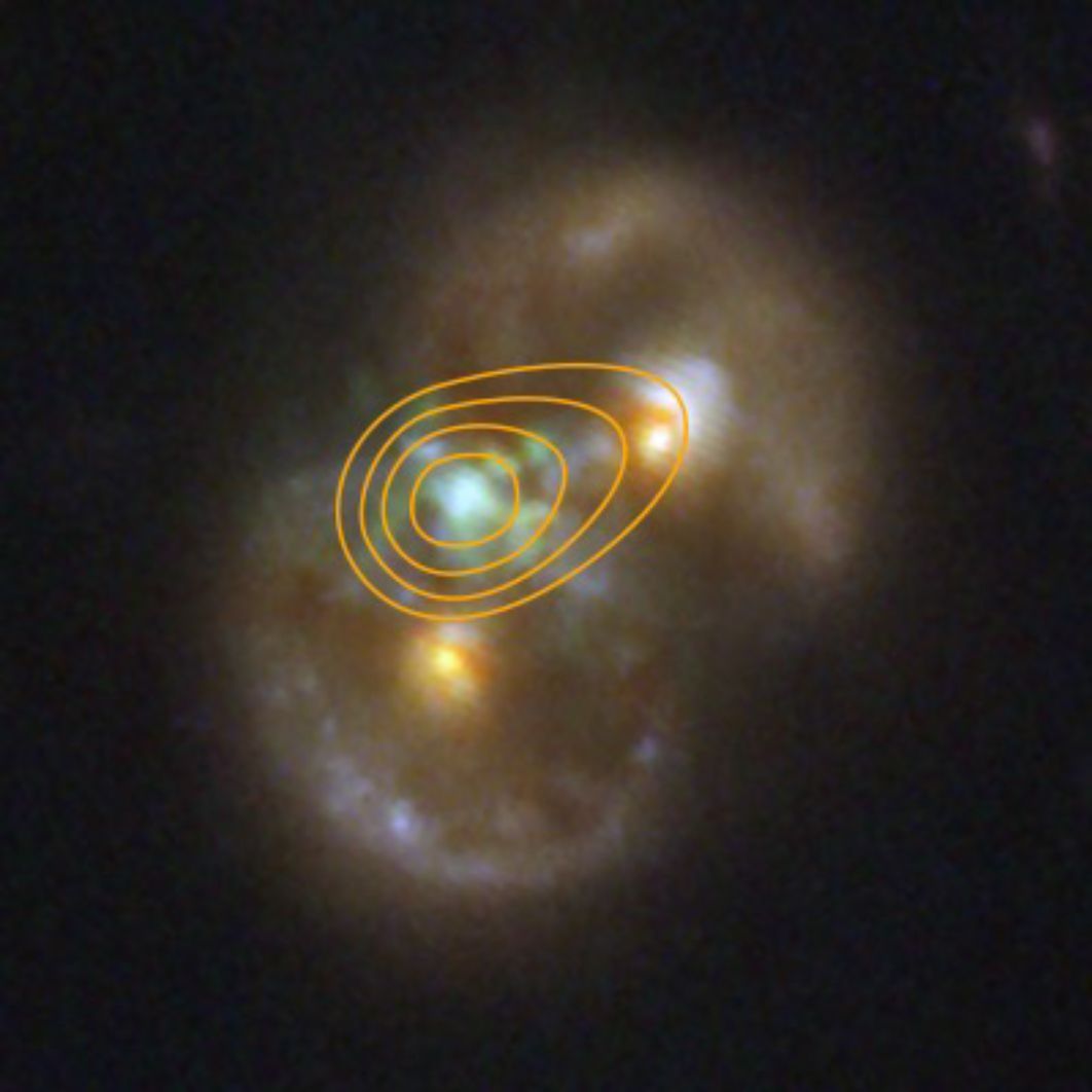 This NIRCam image of the Infinity Galaxy from NASA’s James Webb Space Telescope is overlaid with a contour map based on radio data from the Very Large Array. The central radio emission aligns precisely with the infrared glow between the two galactic nuclei, indicating the presence of a supermassive black hole. These radio signals help scientists study how the black hole draws in surrounding material and assess its energy output. 