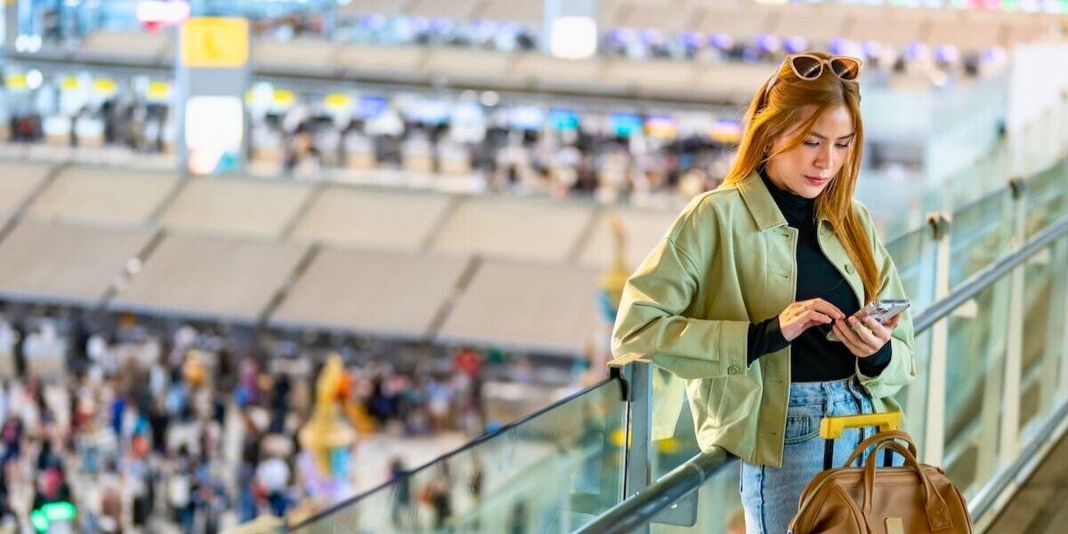 a person checking their app in the airport