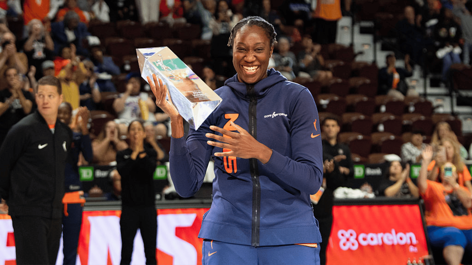 Connecticut Sun center Tina Charles (31) holds the Dawn Staley Community Leadership Award after being awarded it prior to a WNBA game between the Atlanta Dream and the Connecticut Sun on September 10, 2025, at Mohegan Sun Arena in Uncasville, CT
