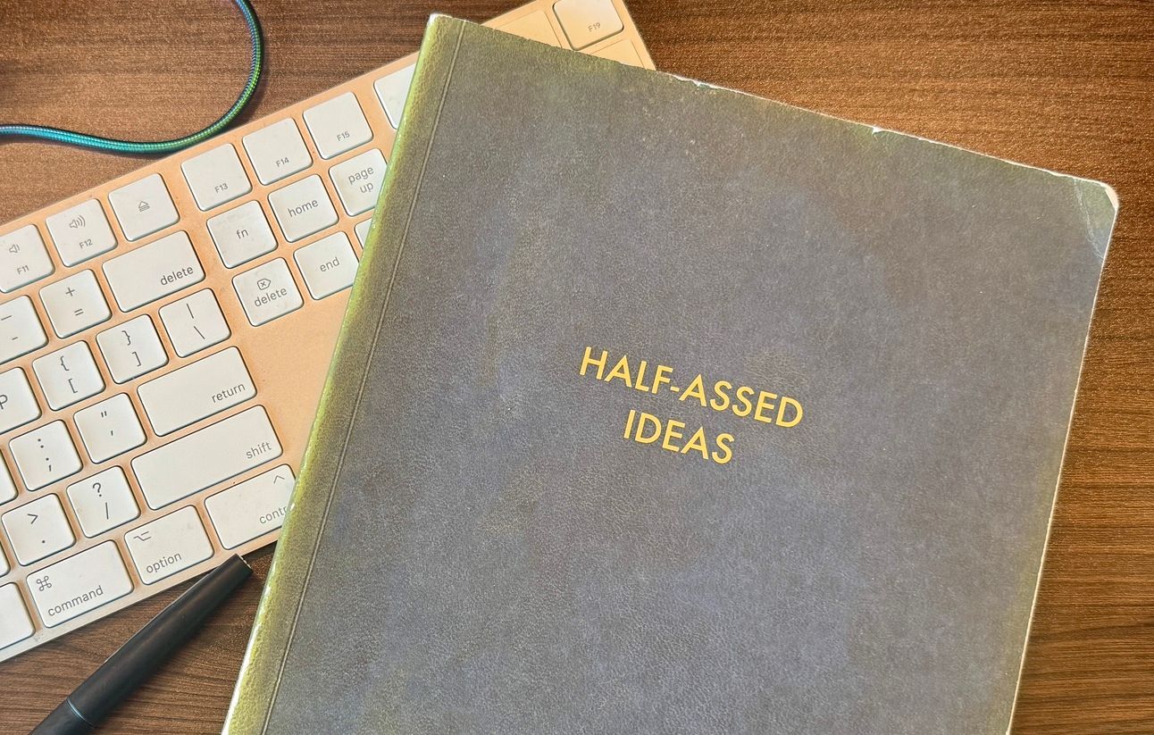 picture of notebook that says "half-asses ideas"