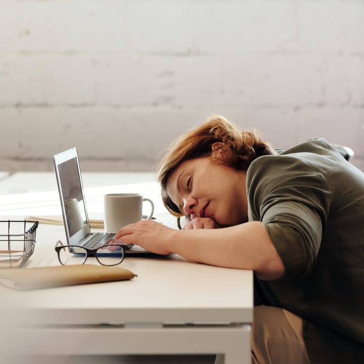 Exhausted person at computer