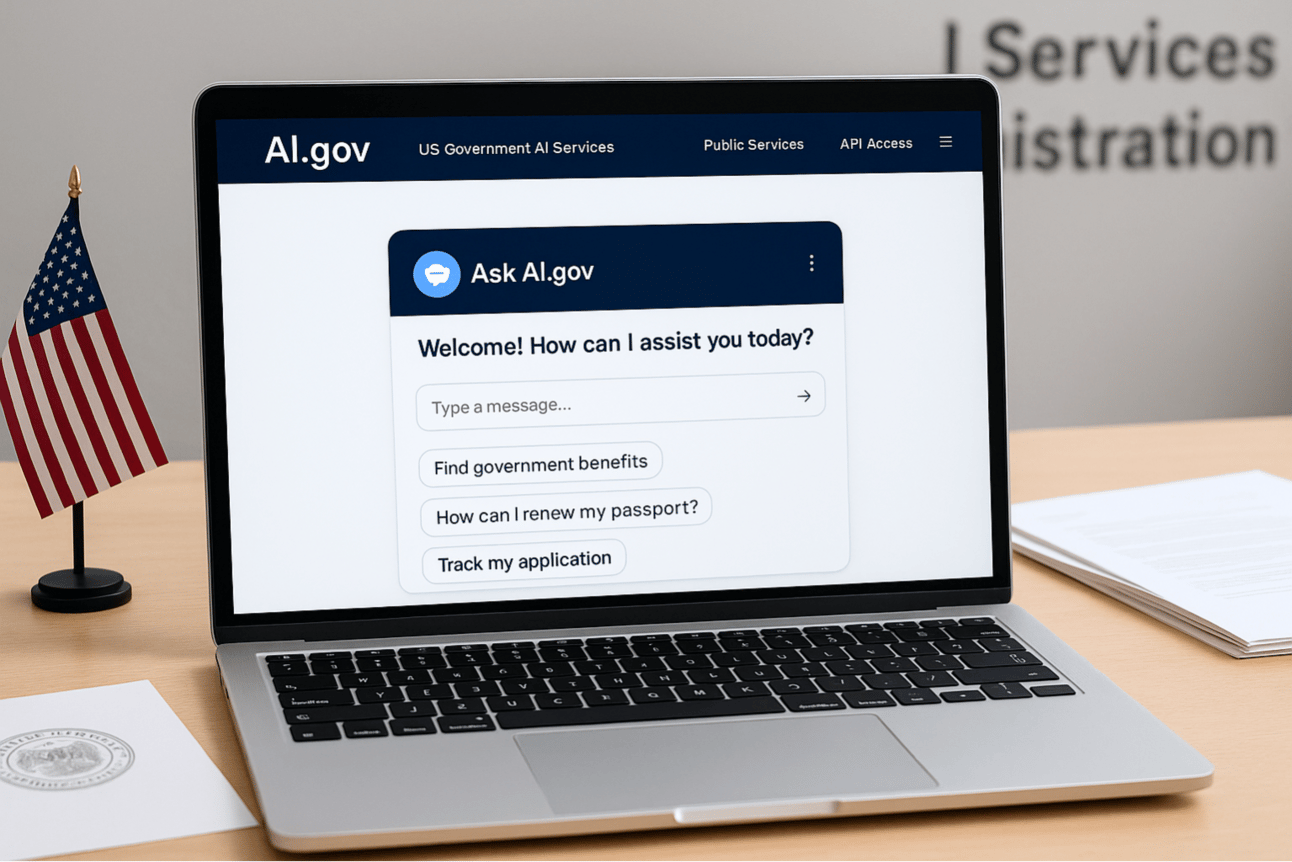 A laptop sits on a light wood desk in a U.S. government office, displaying the homepage of a fictional AI.gov website. The screen shows a clean, modern interface featuring a chatbot titled “Ask AI.gov” with a welcome message and sample prompts such as “Find government benefits,” “How can I renew my passport?” and “Track my application.” A small American flag stands beside the laptop, and official government documents with a General Services Administration seal are partially visible on the desk. The background includes blurred wall text indicating a federal agency setting, suggesting a professional, civic environment focused on digital public services.
