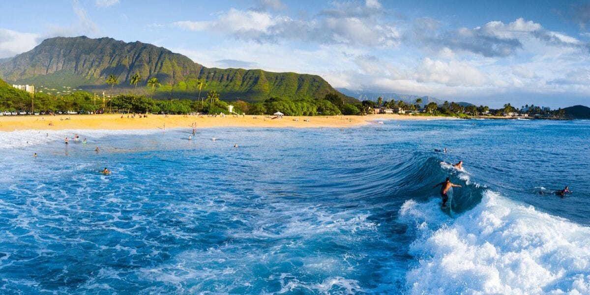 surfers riding a wave