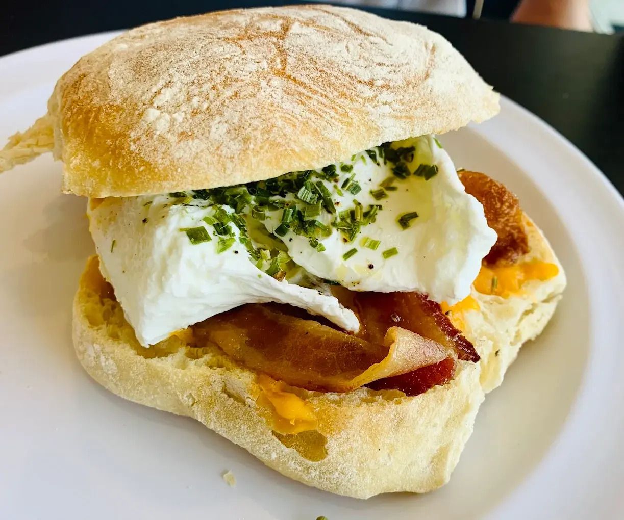 Gourmet sandwich on focaccia bread served with a side salad at a locally owned Jacksonville bakery.