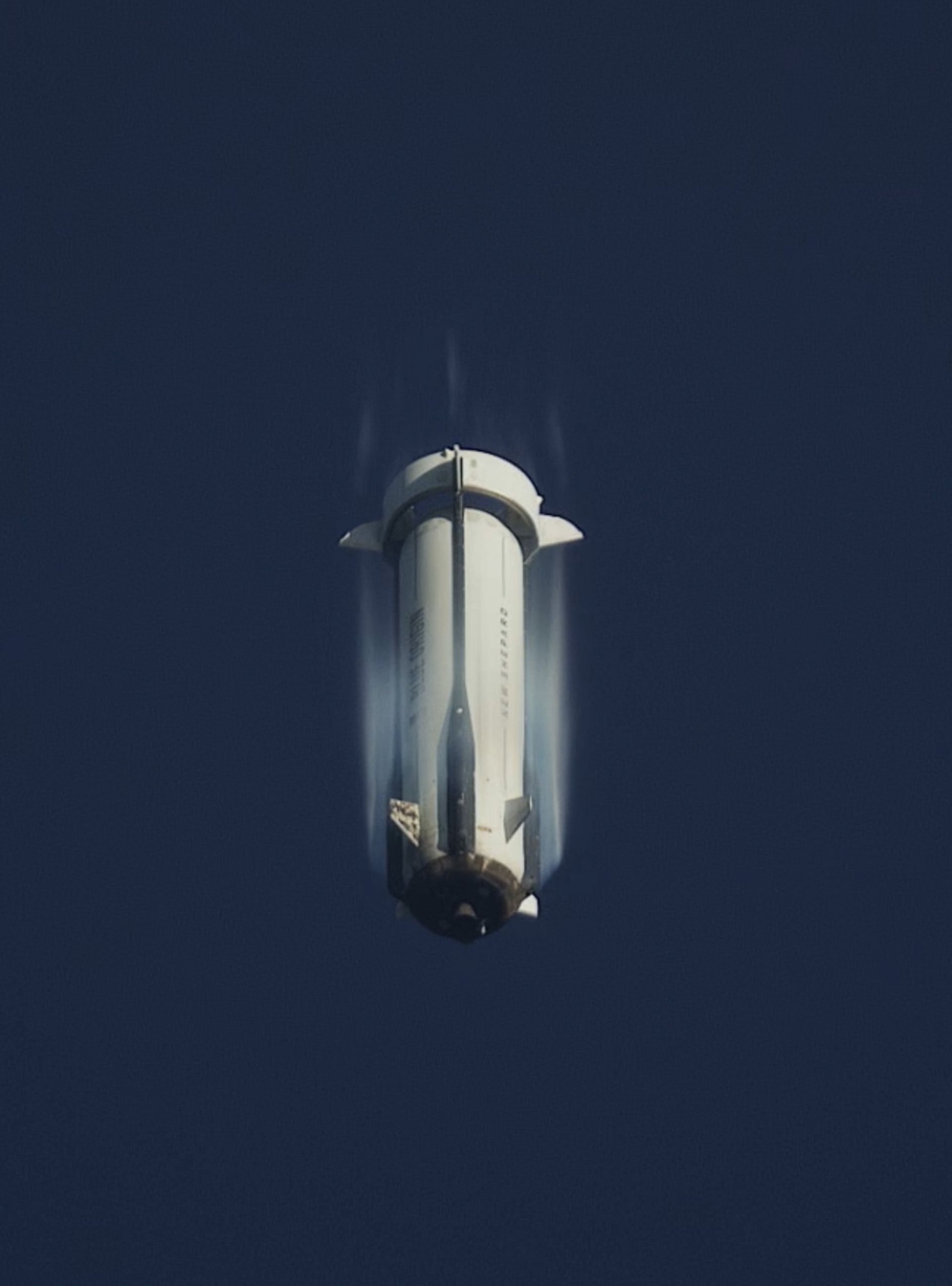 The New Shepard booster descends to the landing pad during Mission NS-35 on September 18, 2025.