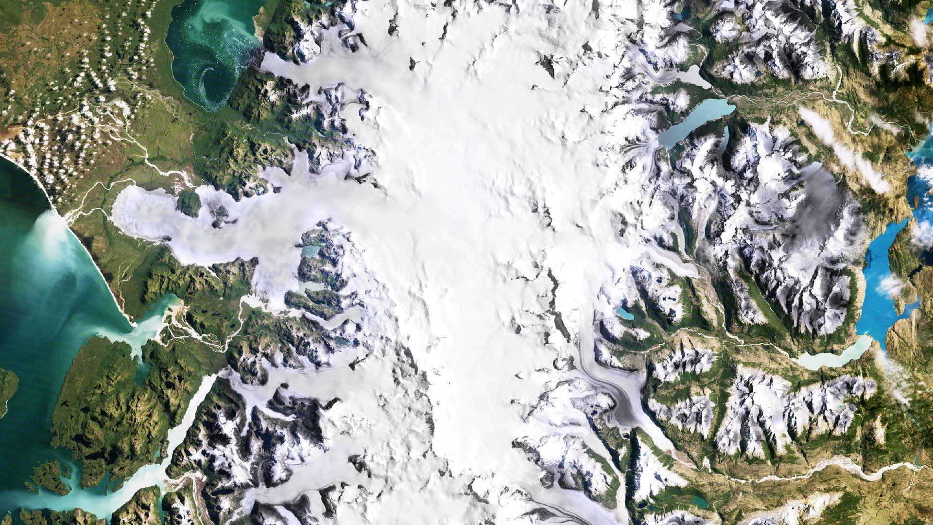 In 1987, the San Rafael and San Quintín glaciers in Chile’s Laguna San Rafael National Park extended much farther, with San Quintín nearly reaching land. The ice field fed numerous outlet glaciers, reflecting a more expansive cryospheric footprint.