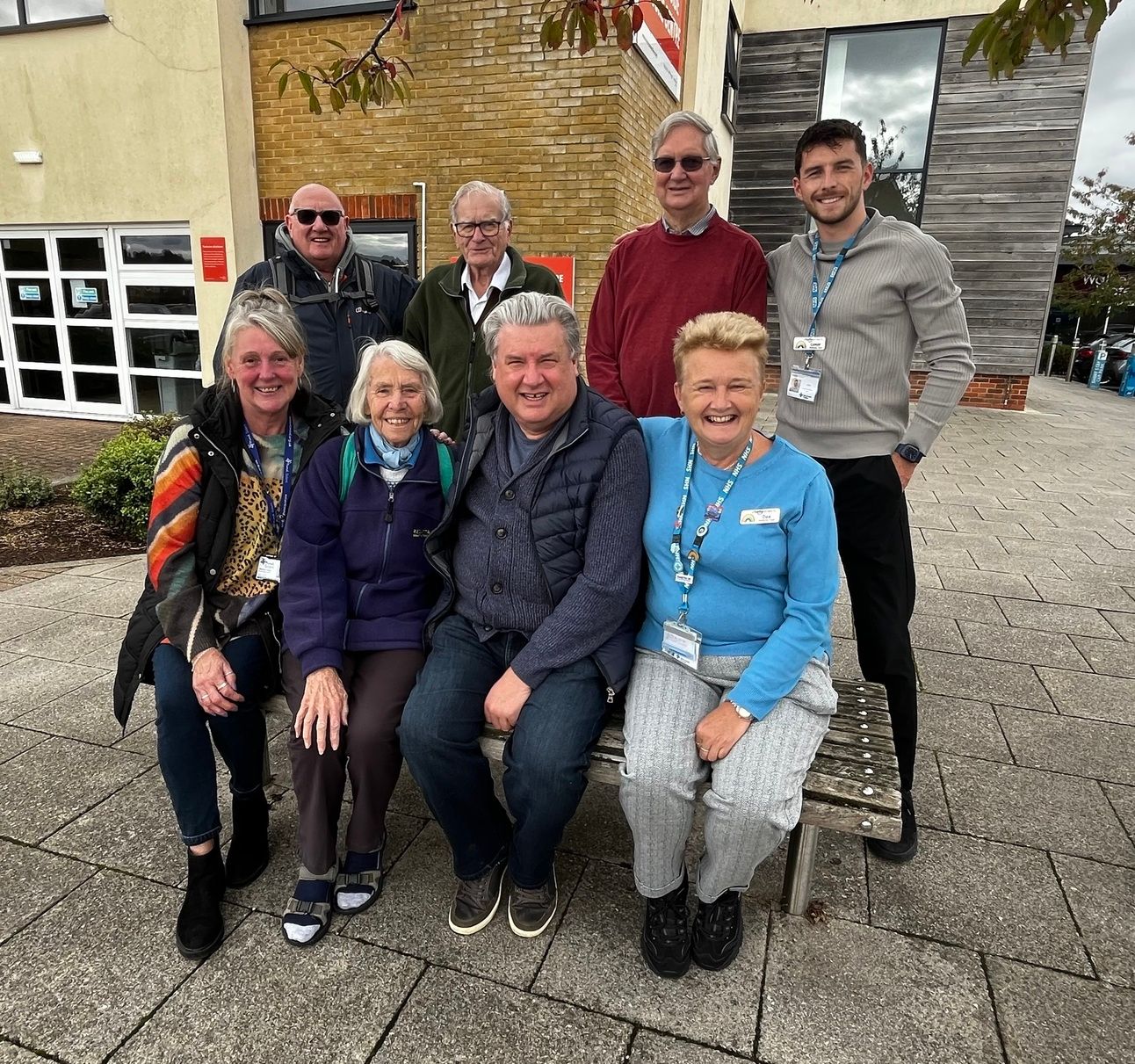 Whiteley wellbeing walks - attendees sat on a bench outside the leisure centre, smiling