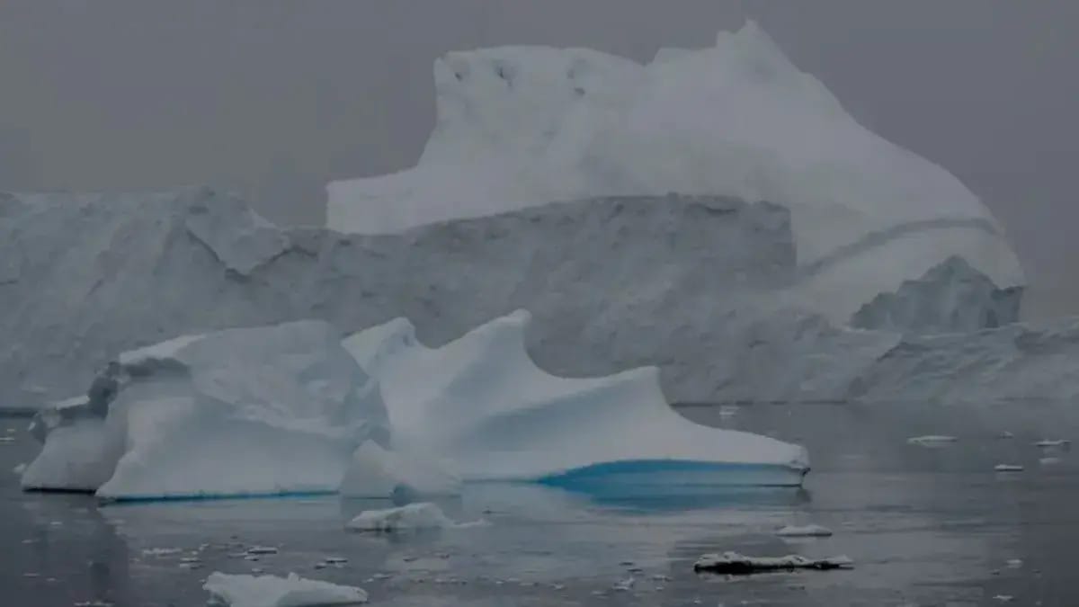 Glaciers are shown above what appears to be a frozen body of water.