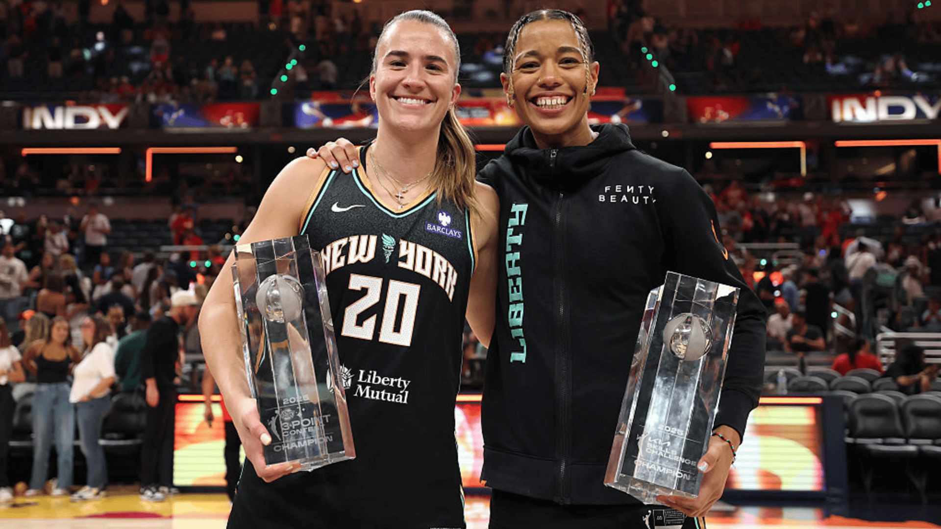 WNBA STARRY 3-Point Contest winner Sabrina Ionescu #20 of the New York Liberty poses with Kia WNBA Skills Challenge winner Natasha Cloud #9 of the New York Liberty during the 2025 AT&T WNBA All-Star weekend at Gainbridge Fieldhouse on July 18, 2025 in Indianapolis, Indiana.