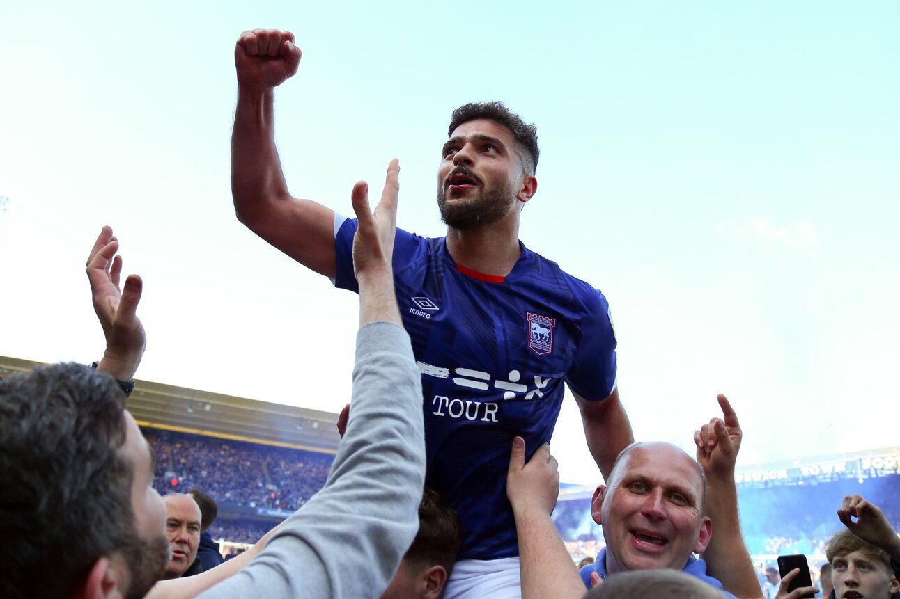 Sam Morsy held aloft by pitch invaders after Ipswich's promotion from League One in 2023