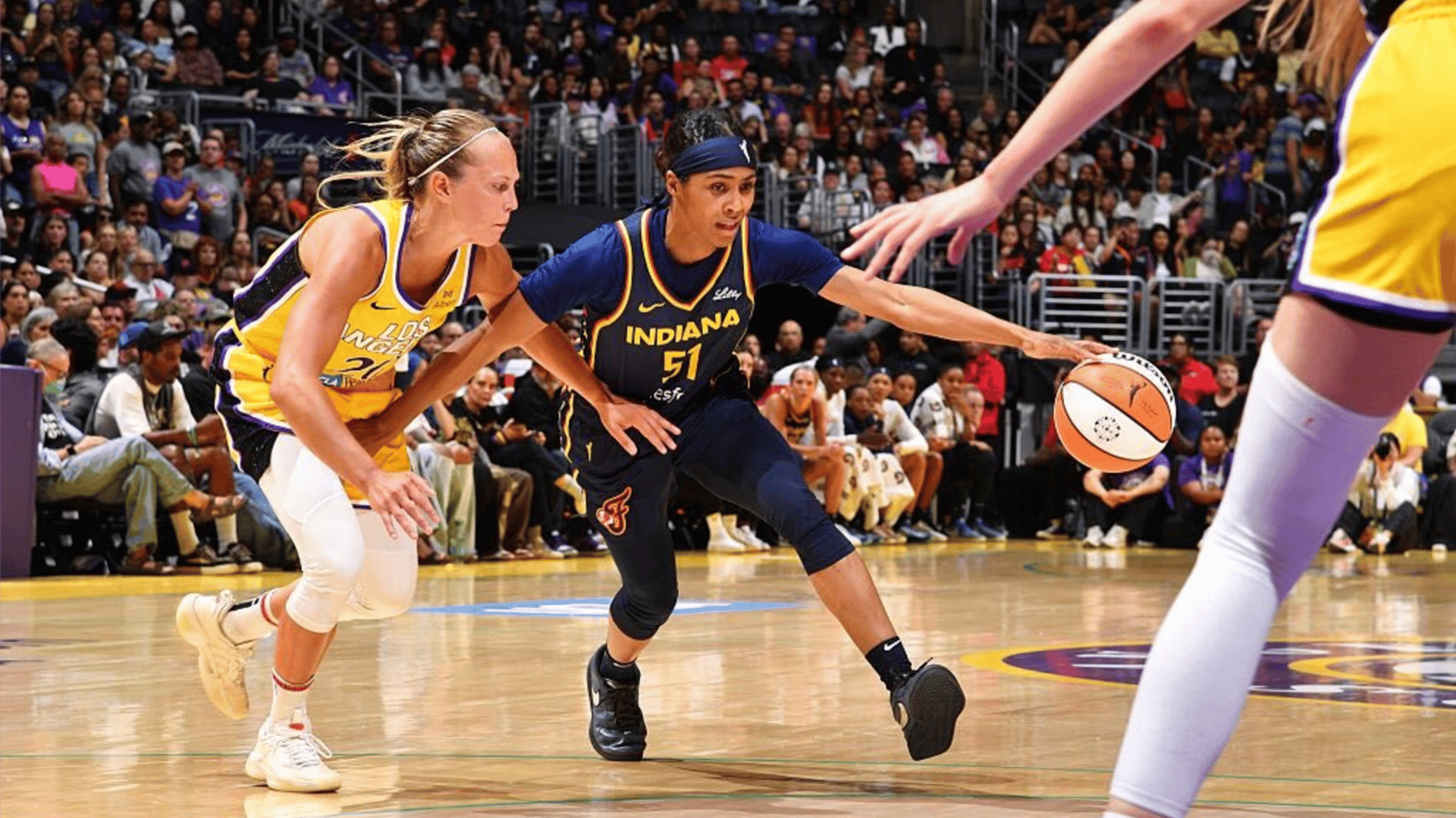 Sydney Colson #51 of the Indiana Fever drives to the basket during the game against the Los Angeles Sparks
