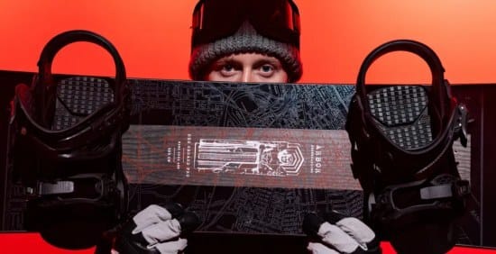 red gerard posing with his signature snowboard