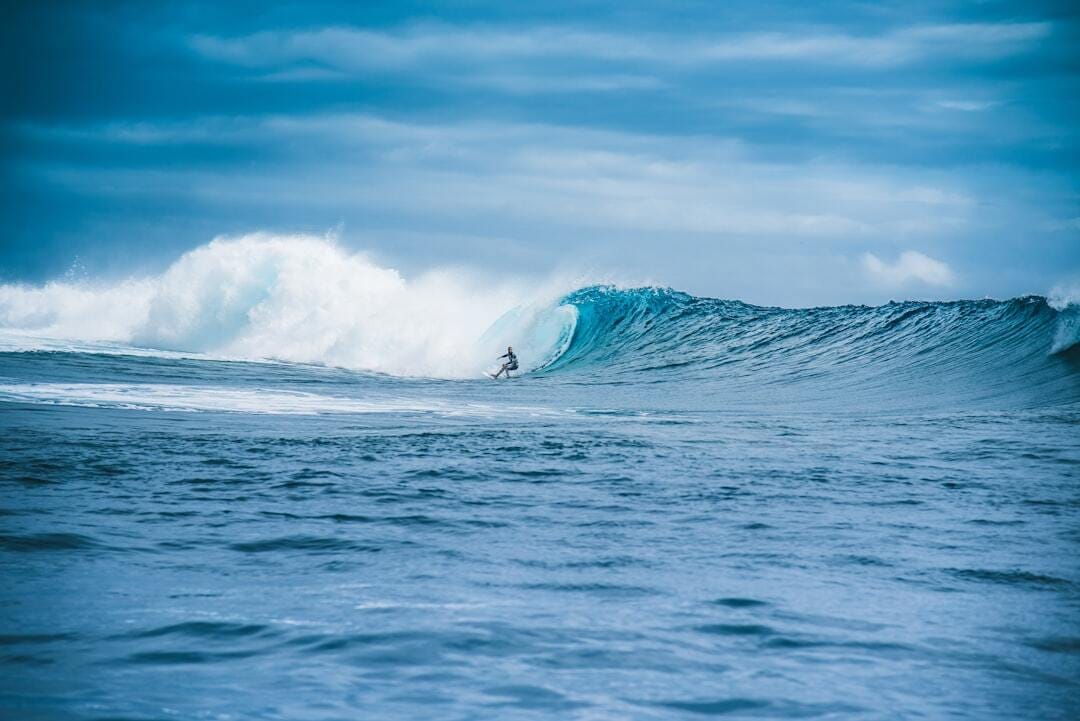 Surfing the wave Tahiti photo @fabecollage 