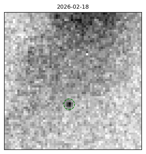A very blurry image shown as a negative, so the asteroid is a black blob in a white and gray background.