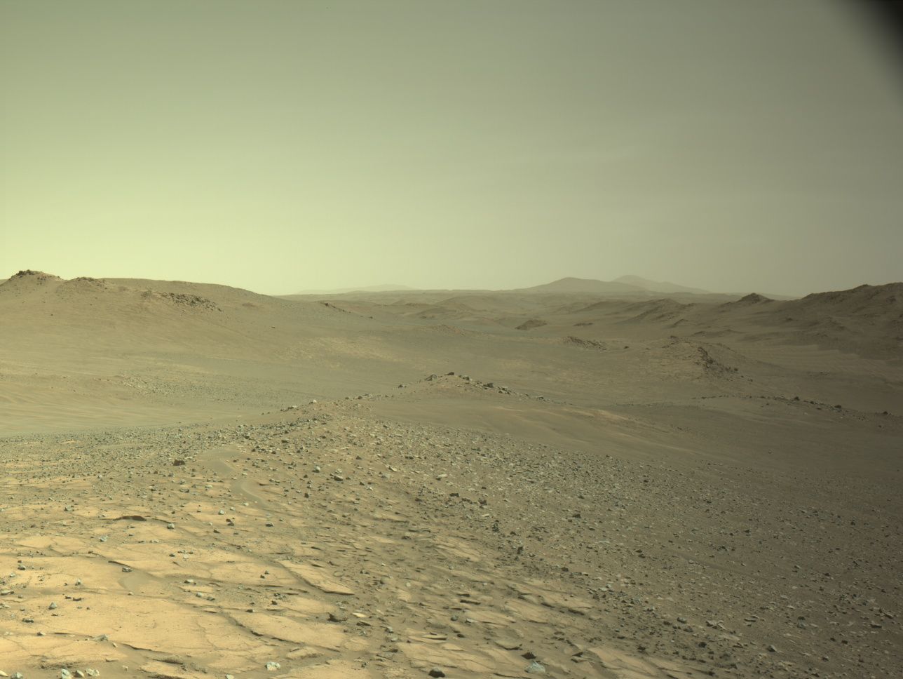 Taken on Sol 1595 using the Left Navigation Camera, this image shows exposed bedrock ideal for close-up analysis. Scientists have planned a series of drives to reach this workspace, where instruments like SHERLOC, PIXL, and WATSON will investigate surface textures and chemical composition.