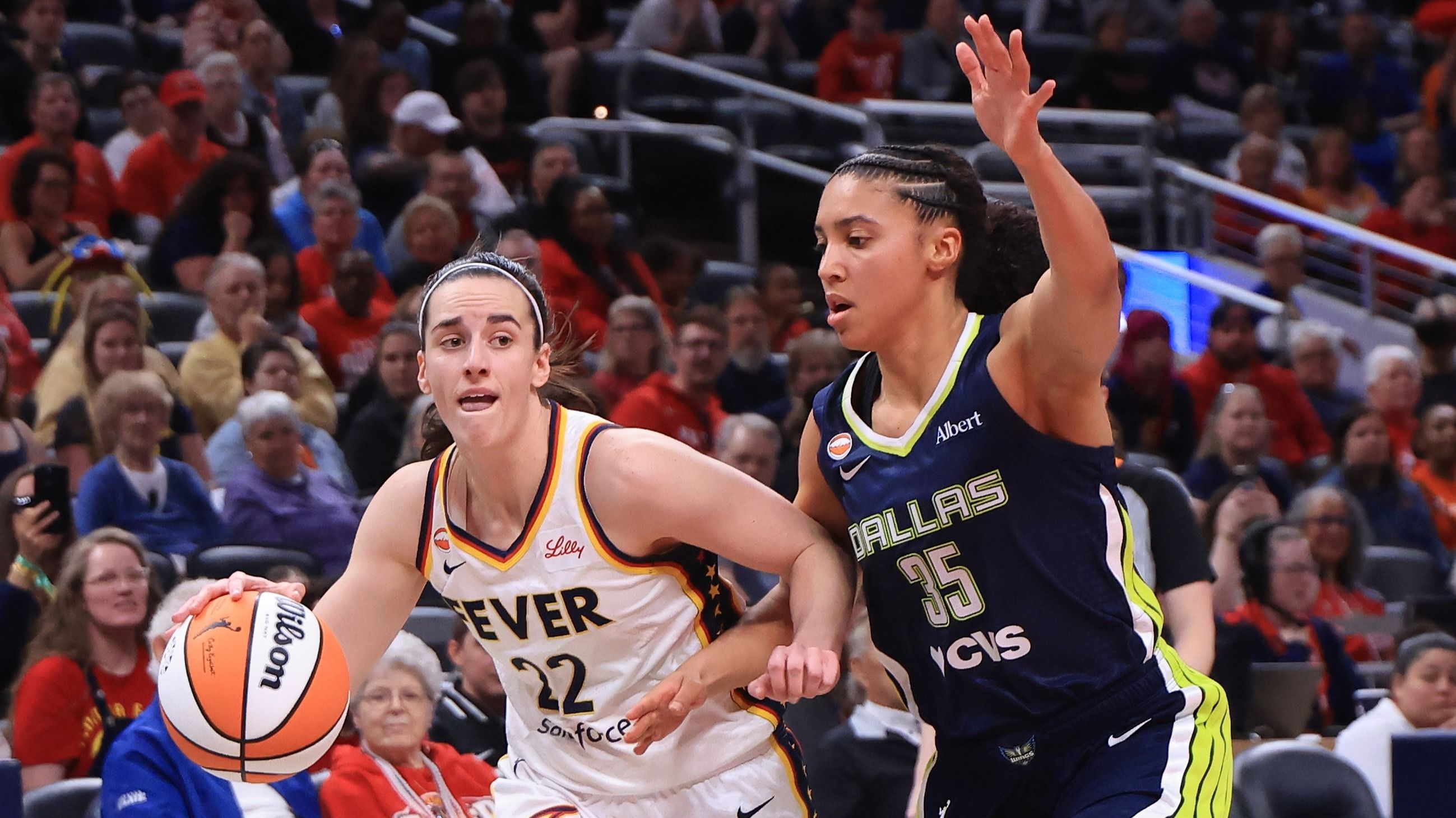 Caitlin Clark #22 of the Indiana Fever brings the ball up the court against Azzi Fudd #35 of the Dallas Wings during the preseason game at Gainbridge Fieldhouse on April 30, 2026 in Indianapolis, Indiana. 